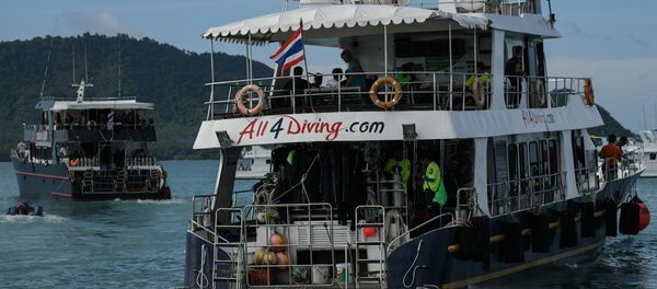 Two boats carrying divers leave Chalong pier in Phuket on July 7, 2018, as rescue operations continue for missing tourists following a boat accident on July 5 Two boats carrying divers leave Chalong pier in Phuket on July 7, 2018, as rescue operations continue for missing tourists following a boat accident on July 5 - Sputnik International