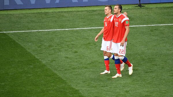 Russia's Denis Cheryshev and Artyom Dzyuba walk after team's 0-5 victory over Saudi Arabia at the World Cup Group A soccer match at the Luzhniki stadium in Moscow, Russia, June 14, 2018 - Sputnik International