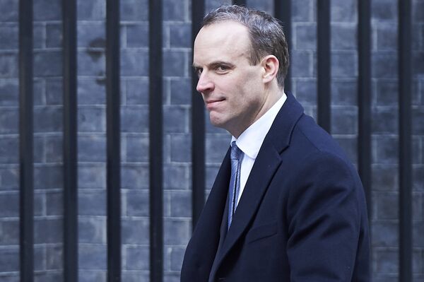 In this file photo taken on February 06, 2018 Dominic Raab, then Minister of State for Housing and Planning, leaves 10 Downing street after the weekly cabinet meeting on February 6, 2018 in London In this file photo taken on February 06, 2018 Dominic Raab, then Minister of State for Housing and Planning, leaves 10 Downing street after the weekly cabinet meeting on February 6, 2018 in London - Sputnik International
