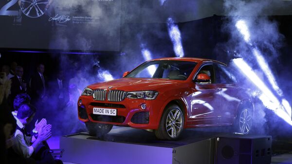 (File) A new BMW X4 vehicle is unveiled during a news conference at the BMW manufacturing plant in Greer, S.C., Friday, March 28, 2014 - Sputnik International
