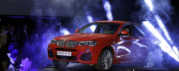 A new BMW X4 vehicle is unveiled during a news conference at the BMW manufacturing plant in Greer, S.C., March 28, 2014 - Sputnik International