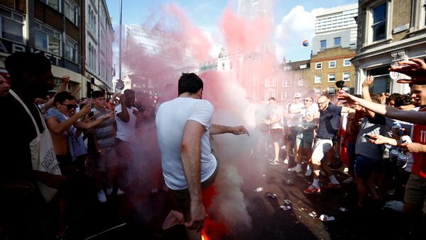 Soccer Football - World Cup - England fans watch Sweden vs England - London, Britain - July 7, 2018 England fans set off smoke bombs after the match - Sputnik International