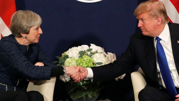 U.S. President Donald Trump shake hands with Britain's Prime Minister Theresa May during the World Economic Forum (WEF) annual meeting in Davos, Switzerland January 25, 2018 - Sputnik International