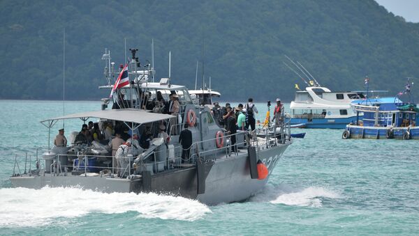 A Thai Royal Navy boat is seen during a searching operation for missing passengers of a capsized tourist boat at a pier in Phuket Thailand, July 7, 2018. - Sputnik International