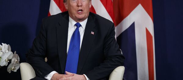 President Donald Trump listens during a meeting with British Prime Minister Theresa May at the World Economic Forum, Thursday, Jan. 25, 2018, in Davos. - Sputnik International