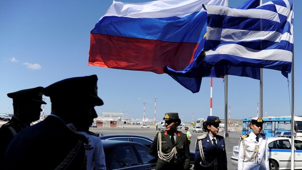 FILE PHOTO: Greek police and army officers stand by Greek, Russian and EU flags as they wait for the arrival of Russian President Vladimir Putin in Athens, Greece airport, May 27, 2016. - Sputnik International