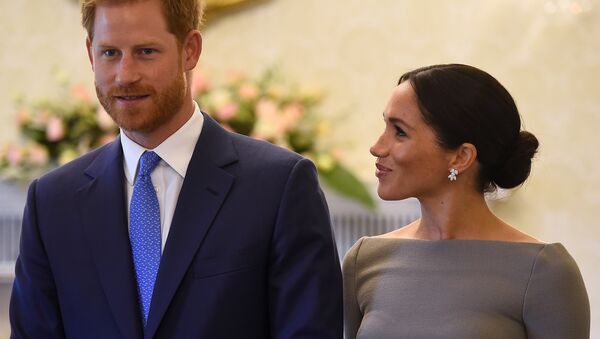 Britain's Prince Harry and his wife Meghan, Duchess of Sussex, smile as they prepare to meet Ireland's President, Michael Higgins, on their second day of a two-day visit to Dublin, Ireland July 11, 2018 - Sputnik International