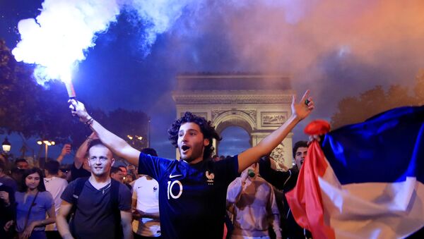 Soccer Football - World Cup - Semi-Final - France vs Belgium - Paris, France, July 10, 2018 - France fans react on the Champs-Elysees after defeating Belgium in their World Cup semi-final match - Sputnik International