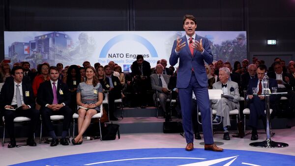 Canada's Prime Minister Justin Trudeau addresses the 'NATO Engages: The Brussels Summit Dialogue' event ahead of the NATO (North Atlantic Treaty Organization) summit, at the NATO headquarters in Brussels, on July 11, 2018 - Sputnik International
