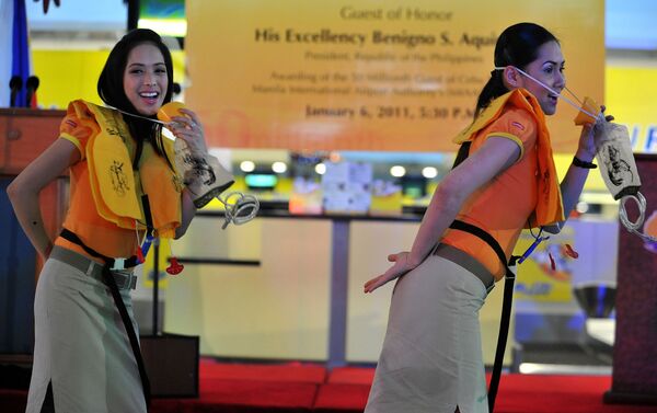 Cebu Pacific's crew dancing during a safety demonstration in Manila - Sputnik International