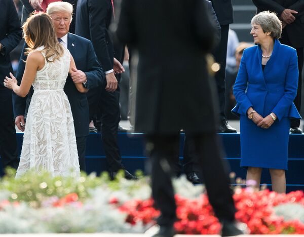 US President Donald Trump and his wife Melania, Britain's Prime Minister Theresa May during a show prior a dinner at the Parc du Cinquantenaire - Jubelpark park in Brussels, Belgium July 11, 2018. Picture taken July 11, 2018. US President Donald Trump and his wife Melania, Britain's Prime Minister Theresa May during a show prior a dinner at the Parc du Cinquantenaire - Jubelpark park in Brussels, Belgium July 11, 2018. Picture taken July 11, 2018. - Sputnik International
