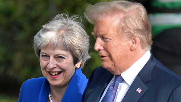 Britain's Prime Minister Theresa May and U.S. President Donald Trump during a meeting of NATO Heads of State and Government in Brussels, Belgium on July 12, 2018 - Sputnik International