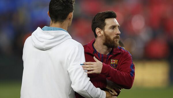 Barcelona's Lionel Messi, right and Real Madrid's Cristiano Ronaldo greets each other before the Spanish La Liga soccer match between Barcelona and Real Madrid, dubbed 'el clasico', at Camp Nou stadium in Barcelona, Spain, 6 May 2018 - Sputnik International