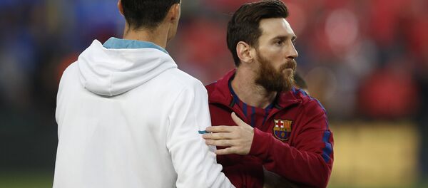 Barcelona's Lionel Messi, right and Real Madrid's Cristiano Ronaldo greets each other before a Spanish La Liga soccer match between Barcelona and Real Madrid, dubbed 'el clasico', at the Camp Nou stadium in Barcelona, Spain, Sunday, May 6, 2018 Barcelona's Lionel Messi, right and Real Madrid's Cristiano Ronaldo greets each other before a Spanish La Liga soccer match between Barcelona and Real Madrid, dubbed 'el clasico', at the Camp Nou stadium in Barcelona, Spain, Sunday, May 6, 2018 - Sputnik International