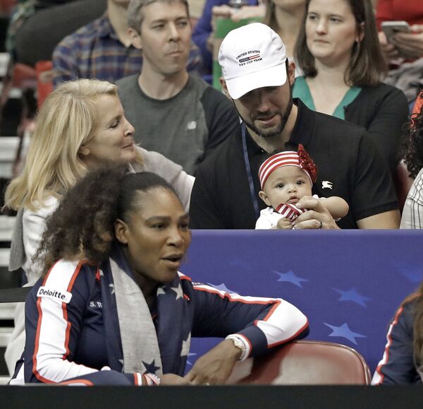 Serena Williams is pictured with her husband Alexis Ohanian and their baby daughter Alexis Olympia in February 2018 Serena Williams is pictured with her husband Alexis Ohanian and their baby daughter Alexis Olympia in February 2018 - Sputnik International