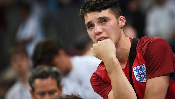 Dejected England's fan reacts after team's 1-2 loss at the World Cup semifinal soccer match between Croatia and England, at the Luzhniki stadium, in Moscow, Russia, July 11, 2018. - Sputnik International