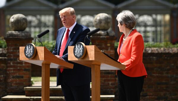 US President Donald Trump (L) and Britain's Prime Minister Theresa May hold a joint press conference following their meeting at Chequers, the prime minister's country residence, near Ellesborough, northwest of London on July 13, 2018 on the second day of Trump's UK visit - Sputnik International