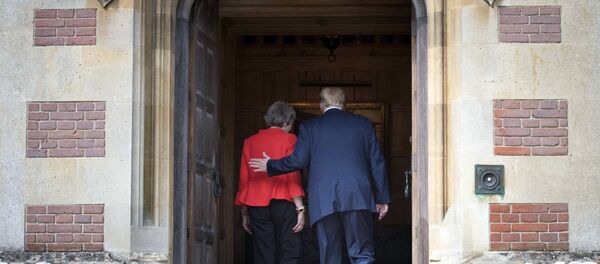 British Prime Minister Theresa May greets U.S President Donald Trump before their meeting at Chequers, in Buckinghamshire, England, Friday, July 13, 2018. British Prime Minister Theresa May greets U.S President Donald Trump before their meeting at Chequers, in Buckinghamshire, England, Friday, July 13, 2018. - Sputnik International