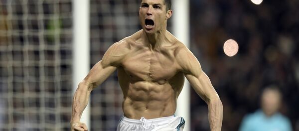 (FILES) In this file photo taken on April 11, 2018 Real Madrid's Portuguese forward Cristiano Ronaldo celebrates after scoring a penalty during the UEFA Champions League quarter-final second leg football match between Real Madrid CF and Juventus FC at the Santiago Bernabeu stadium in Madrid on April 11, 2018 - Sputnik International