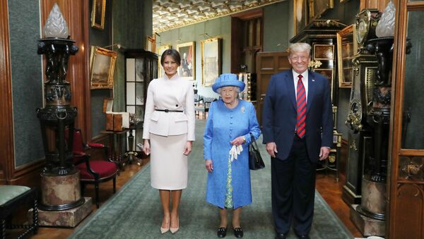 Britain's Queen Elizabeth stands with U.S. President Donald Trump and his wife, Melania in the Grand Corridor during their visit to Windsor Castle, Windsor, Britain July 13, 2018 - Sputnik International