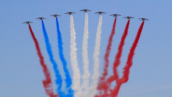 Alpha jets from the French Air Force Patrouille de France fly during the traditional Bastille Day military parade on the Champs-Elysees Avenue in Paris, France, July 14, 2018 - Sputnik International
