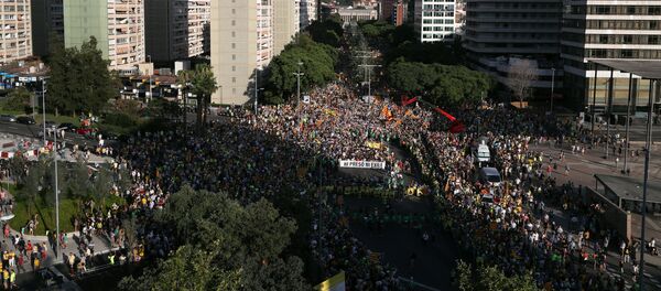 People hold banners during a protest against the imprisonment of the Catalan separatist leaders in Barcelona, Spain, July 14, 2018. People hold banners during a protest against the imprisonment of the Catalan separatist leaders in Barcelona, Spain, July 14, 2018. - Sputnik International