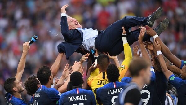 France's players and their head coach Didier Deschamps celebrate team's 4-2 victory in the World Cup final soccer match between France and Croatia at the Luzhniki stadium, in Moscow, Russia, July 15, 2018. - Sputnik International