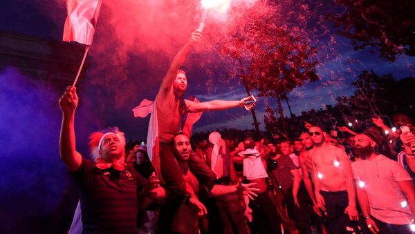 Soccer Football - World Cup - Final - France vs Croatia - Paris, France, July 15, 2018 - France fans celebrate on the Champs-Elysees Avenue after France win the Soccer World Cup final. - Sputnik International
