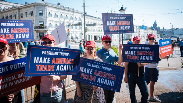 Trump supporters hold banners during a demonstration at the Esplanadi park in Helsinki, Finland, on July 16, 2018, hours ahead of the meeting between US President and his Russian counterpart - Sputnik International