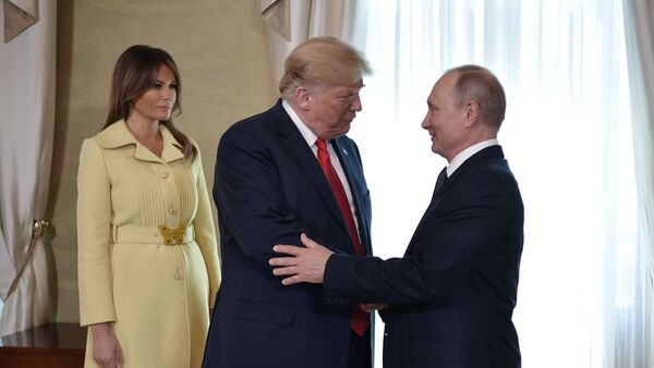 Russia's President Vladimir Putin (R) greets U.S. President Donald Trump, as First lady Melania Trump stands nearby, during a meeting in Helsinki, Finland July 16, 2018 - Sputnik International