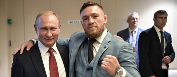 Russian President Vladimir Putin and Irish mixed martial artist Conor McGregor, right, during the break in the 2018 FIFA World Cup final match between the national teams of France and Croatia at Luzhniki Stadium - Sputnik International