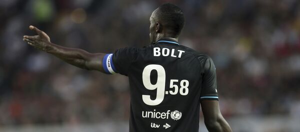 Former Olympic and Jamaican sprinter Usain Bolt wearing a shirt to commemorate his World Record 100m time, in action on the pitch at Old Trafford as part of Unicef's Soccer Aid, Manchester, Sunday, June 10, 2018 - Sputnik International