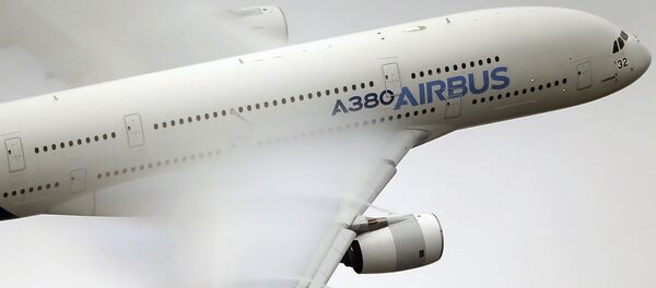 In this June 18 2015 file photo, vapour forms across the wings of an Airbus A380 as it performs a demonstration flight at the Paris Air Show, Le Bourget airport, north of Paris In this June 18 2015 file photo, vapour forms across the wings of an Airbus A380 as it performs a demonstration flight at the Paris Air Show, Le Bourget airport, north of Paris - Sputnik International