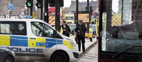 Police officers cordon off the territory near the UK Parliament in London where an assailant attacked a police officer and pedestrians. Police officers cordon off the territory near the UK Parliament in London where an assailant attacked a police officer and pedestrians. - Sputnik International