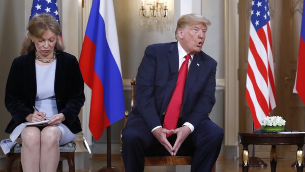 Interpreter interpreter Marina Gross, left, takes notes when U.S. President Donald Trump talks to Russian President Vladimir Putin at the beginning of their one-on-one-meeting at the Presidential Palace in Helsinki, Finland, Monday, July 16, 2018. - Sputnik International