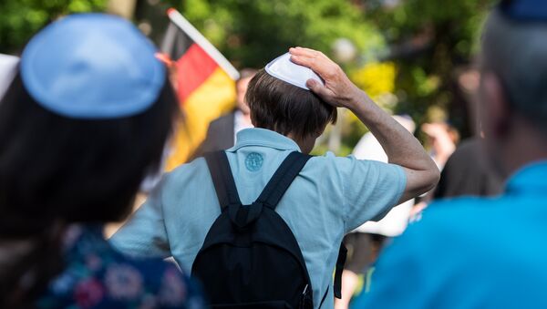 People take part in the so-called Kippa Day against anti-semitism in Hamburg, northern Germany on May 14, 2018 - Sputnik International