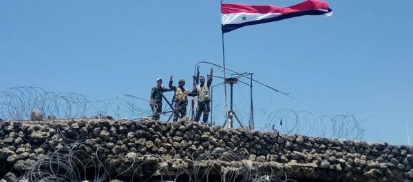 Syrian forces of President Bashar al Assad are seen celebrating on al-Haara hill in Quneitra area, Syria July 17, 2018 Syrian forces of President Bashar al Assad are seen celebrating on al-Haara hill in Quneitra area, Syria July 17, 2018 - Sputnik International
