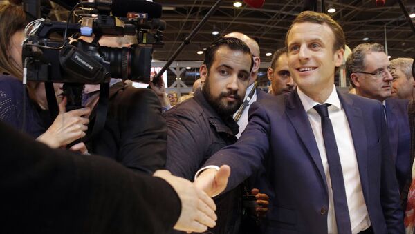Emmanuel Macron, center, flanked by his bodyguard, Alexandre Benalla, left, visits the Agriculture Fair in Paris, Wednesday, March 1, 2017 - Sputnik International