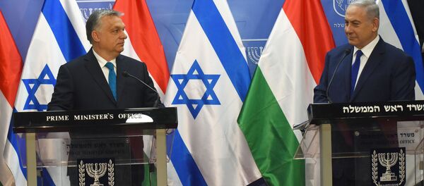Israeli Prime Minister Benjamin Netanyahu speaks during a joint statment with Hungarian Prime Minister Viktor Orban , at the prime minister's office in Jerusalem, July 19, 2018 Israeli Prime Minister Benjamin Netanyahu speaks during a joint statment with Hungarian Prime Minister Viktor Orban , at the prime minister's office in Jerusalem, July 19, 2018 - Sputnik International