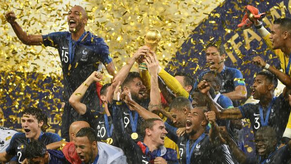 France's players celebrate with the Trophy after winning the World Cup final soccer match between France and Croatia at the Luzhniki stadium, in Moscow, Russia, July 15, 2018 - Sputnik International