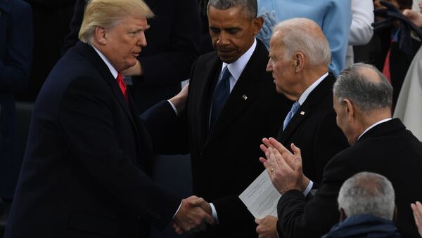 US President Donald Trump (L) shakes hands with former US President Barack Obama (C) and former vice-President Joe Biden after being sworn in as President on January 20, 2017 at the US Capitol in Washington, DC. - Sputnik International