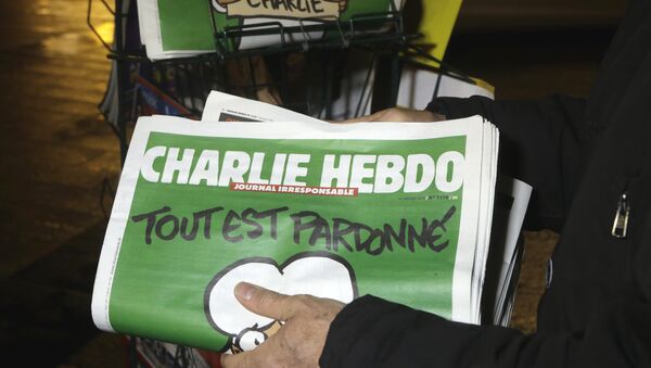 In this Wednesday, Jan. 14, 2015, file photo, a seller of newspapers stocks several Charlie Hebdo newspapers at a newsstand in Nice, France. The French satirical newspaper Charlie Hebdo will publish a German version in the country that has given the best reception to the weekly paper outside France since the attacks that wiped out the Paris editorial staff in January 2015 - Sputnik International