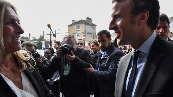 A picture taken on October 11, 2016 shows then French presidential election candidate for the En Marche! movement Emmanuel Macron (R) and Head of Security Alexandre Benalla (2ndR) arriving for a campaign meeting in Le Mans, western France - Sputnik International