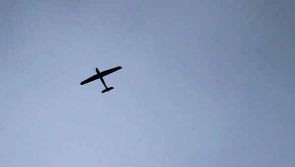 An unmanned aerial vehicle (UAV) flying over the sky in the besieged Eastern Ghouta region on the outskirts of the capital Damascus(File) - Sputnik International
