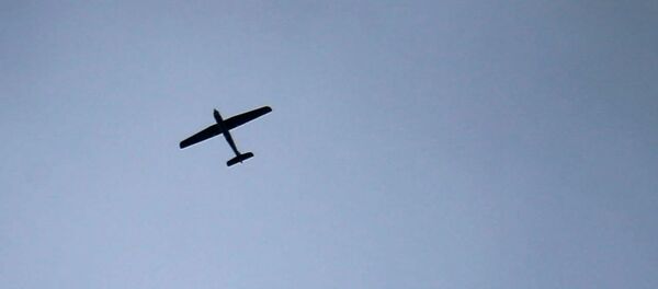 An unmanned aerial vehicle (UAV) flying over the sky in the besieged Eastern Ghouta region on the outskirts of the capital Damascus(File) - Sputnik International