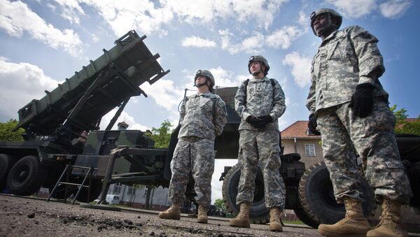 US soldiers stand on May 26, 2010 in front of a Patriot missile battery at an army base in the northern Polish town of Morag - Sputnik International
