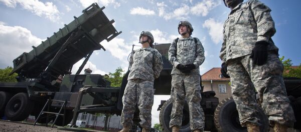 US soldiers stand on May 26, 2010 in front of a Patriot missile battery at an army base in the northern Polish town of Morag US soldiers stand on May 26, 2010 in front of a Patriot missile battery at an army base in the northern Polish town of Morag - Sputnik International
