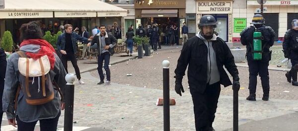 Macron's bodyguard walks after clashing with a May Day protester in Paris, France, May 1, 2018 Macron's bodyguard walks after clashing with a May Day protester in Paris, France, May 1, 2018 - Sputnik International