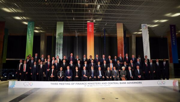 Finance ministers and Central Bank presidents pose for the official photo at the G20 Meeting of Finance Ministers in Buenos Aires, Argentina, July 21, 2018 - Sputnik International