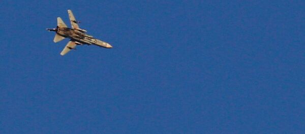 A war jet flies above Syria near the Israeli Syrian border as it is seen from the Israeli-occupied Golan Heights, Israel July 23, 2018 - Sputnik International